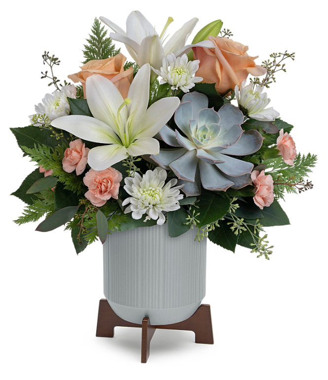 Classic Contemporary Bouquet arrangement by Days Flowers Florida, displaying elegant peach roses, white lilies, and a prominent green Echeveria succulent in a contemporary gray planter on a wooden base.