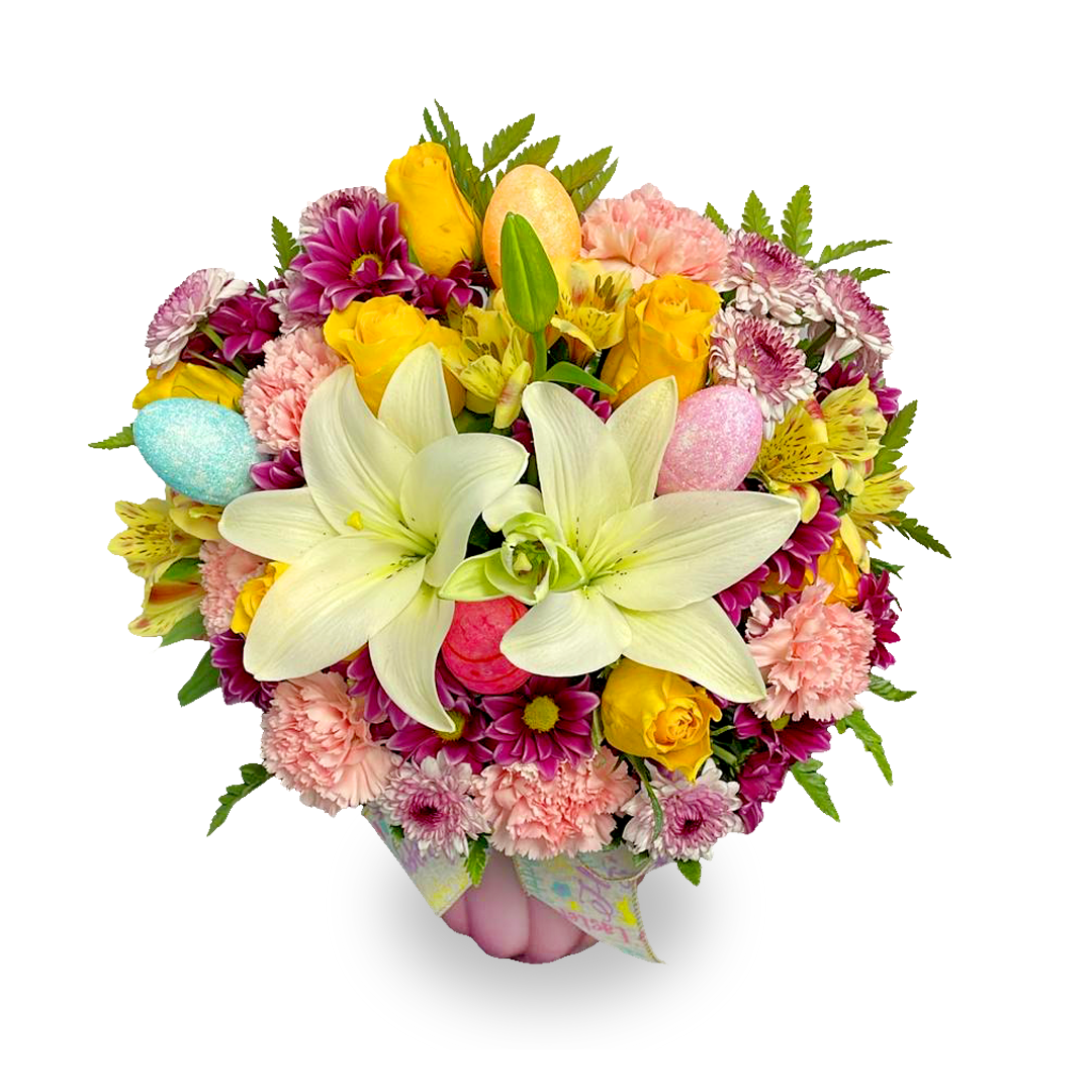 Days Flowers Florida: Easter bouquet featuring pink carnations, purple daisies, and pastel eggs. Spring renewal gift delivery in Port St. Lucie.