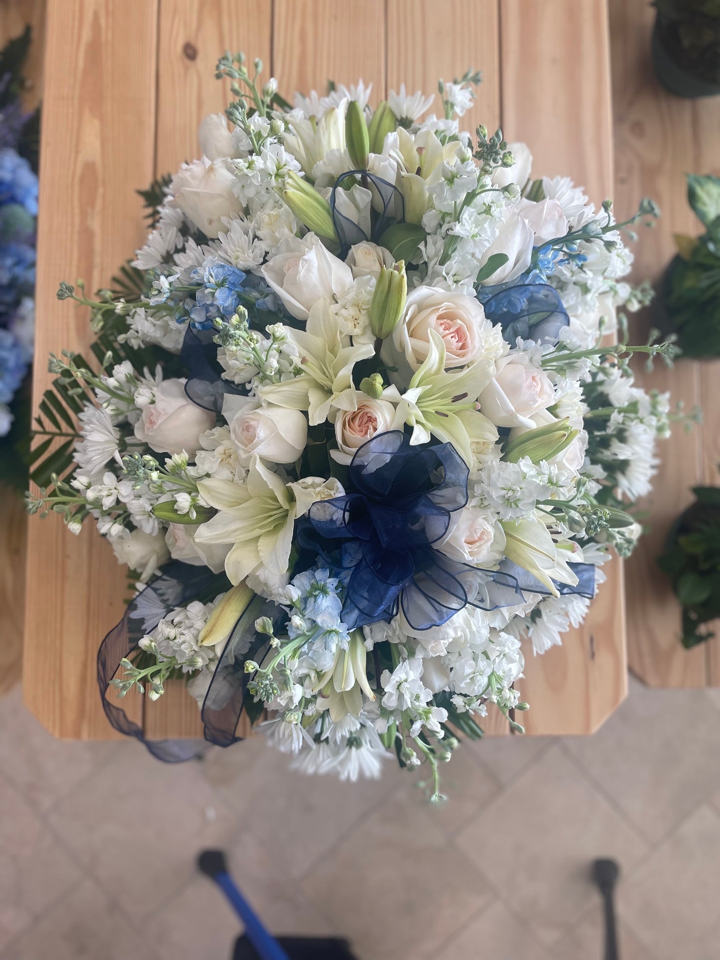 Blue sympathy heart wreath with roses