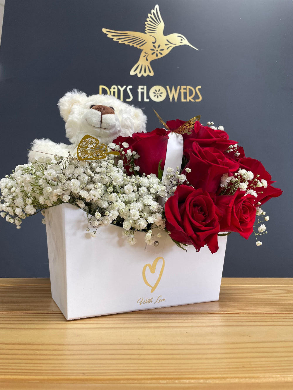 Elegant presentation of the Teddy Love Box design from Days Flowers Florida, ideal as a luxury surprise centerpiece to say I love you on special romantic occasions.