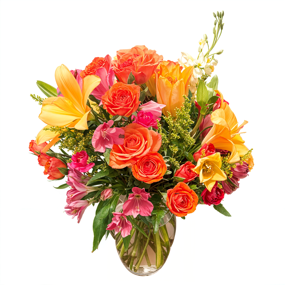 Close-up detail of the red-orange Gerbera daisy and vibrant fuchsia Peruvian lilies in the Tropical Fantasy bouquet.