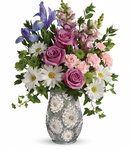 Elegant floral arrangement with purple roses and white daisies in a decorative vase, available for free delivery in Florida.