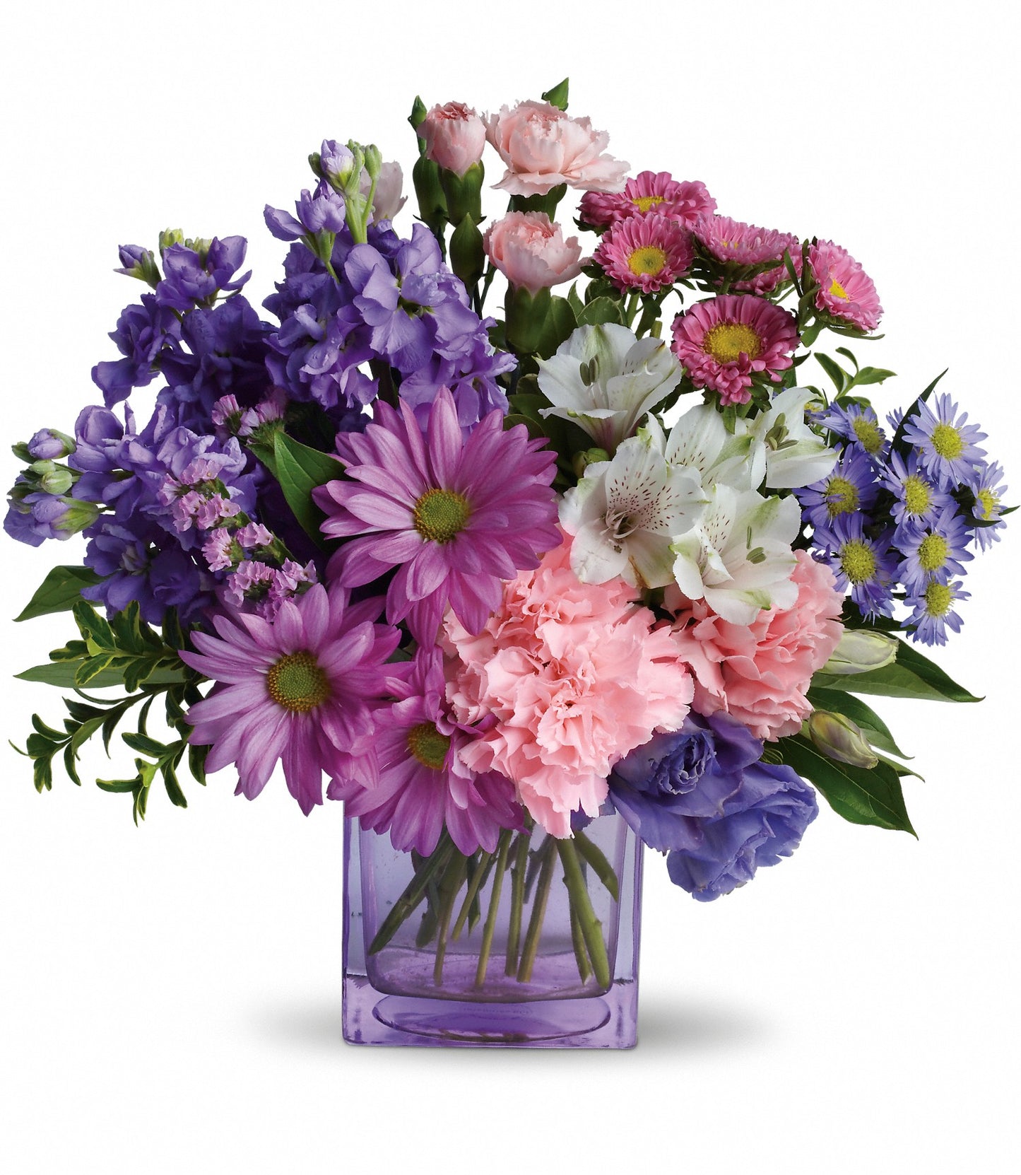 Heart's Delight flower arrangement featuring pink carnations, lavender stock, and purple lisianthus in a lavender glass cube vase by Days Flowers Florida