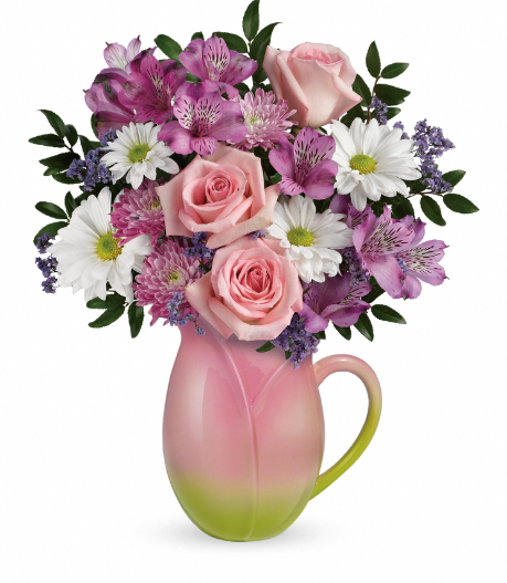 Elegant pink rose and purple flower arrangement in a green jug, perfect for delivery in Summerfield, Ocala, Orlando, The Villages, and Port St. Lucie.