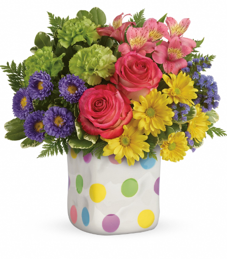 Vibrant roses, alstroemeria, and daisies in a playful polka-dot pot, perfect for summer gifting in Florida.