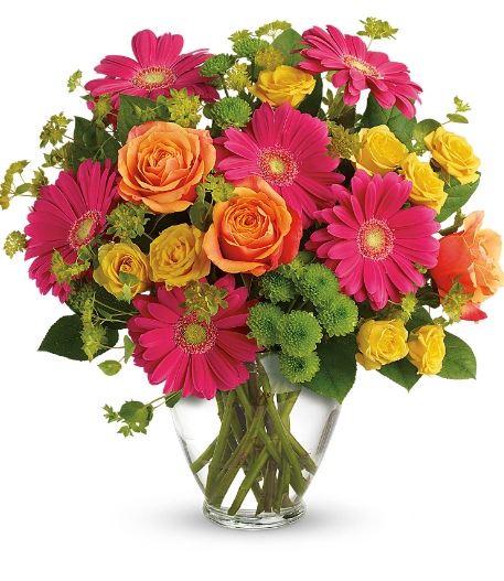 Days Flowers Florida: Bright floral arrangement featuring pink gerberas, orange roses, yellow daisies in a clear vase, perfect for Summerfield, Ocala, Orlando delivery.