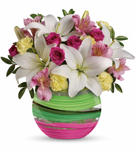 Elegant white lilies, pink roses, and yellow carnations in a green striped vase, perfect for delivery in Summerfield, Ocala, Orlando, The Villages, and Port St. Lucie.