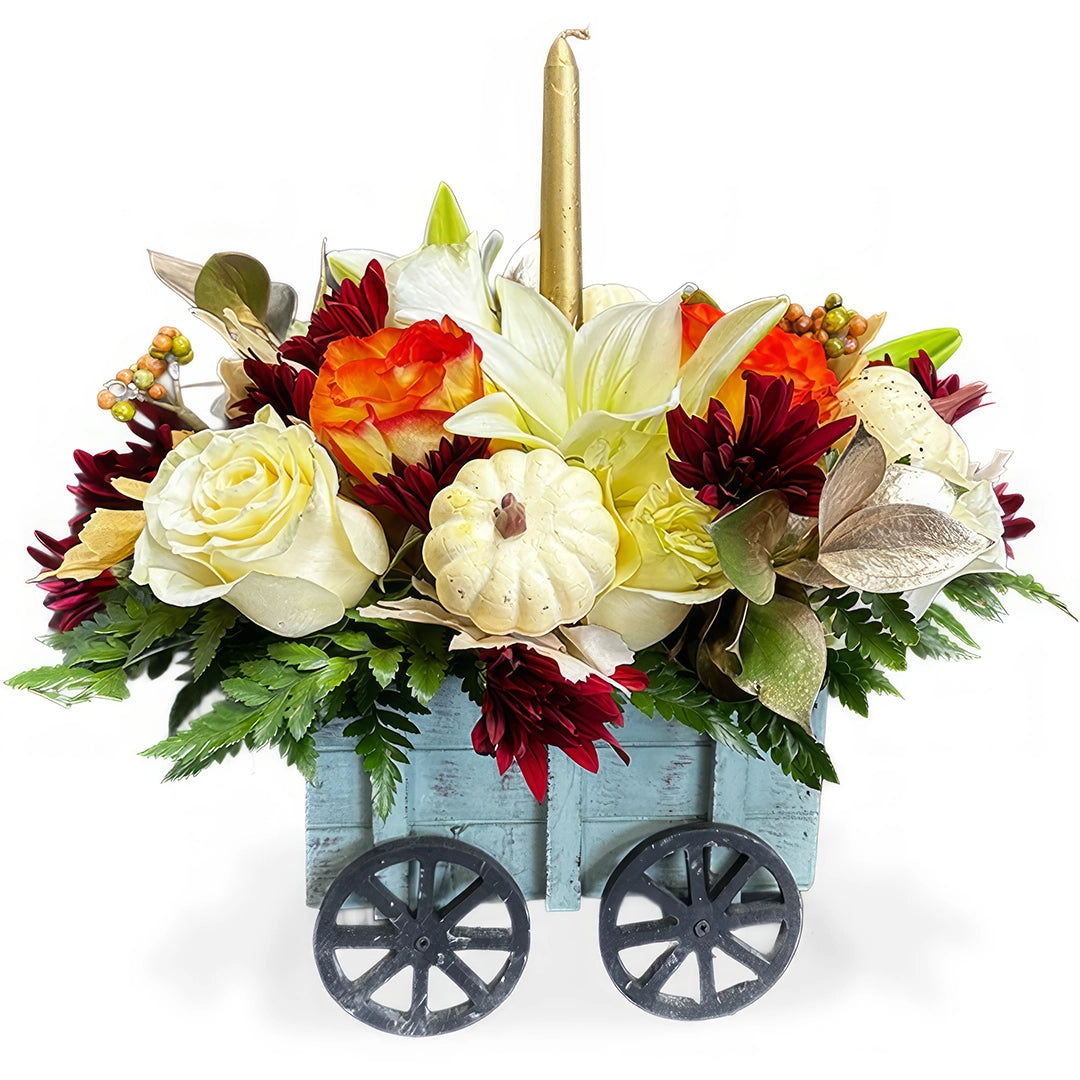 Days Flowers Florida: Thanksgiving floral wagon with warm blooms, pumpkin, and candle. Charming autumn centerpiece delivery in Summerfield, FL