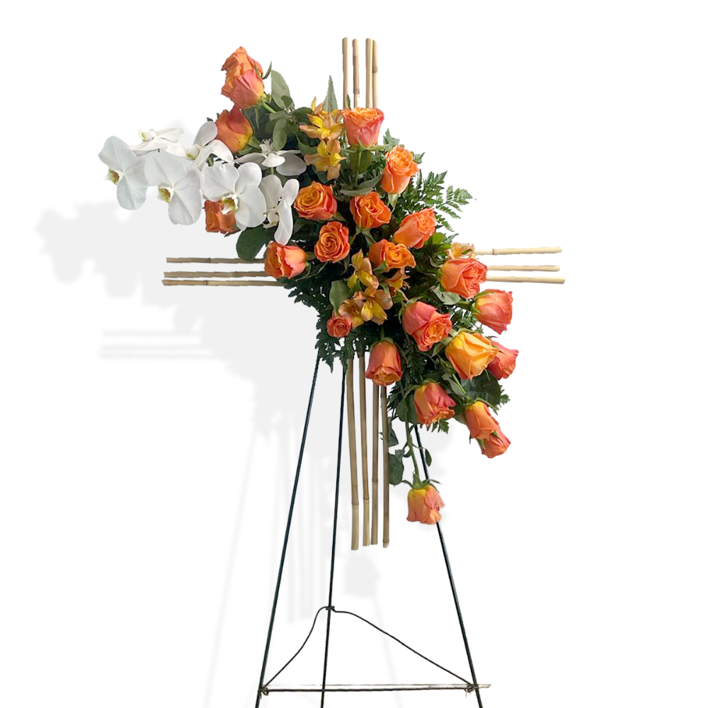 Side perspective highlighting the sturdy natural bamboo structural backing of the standing floral cross arrangement.