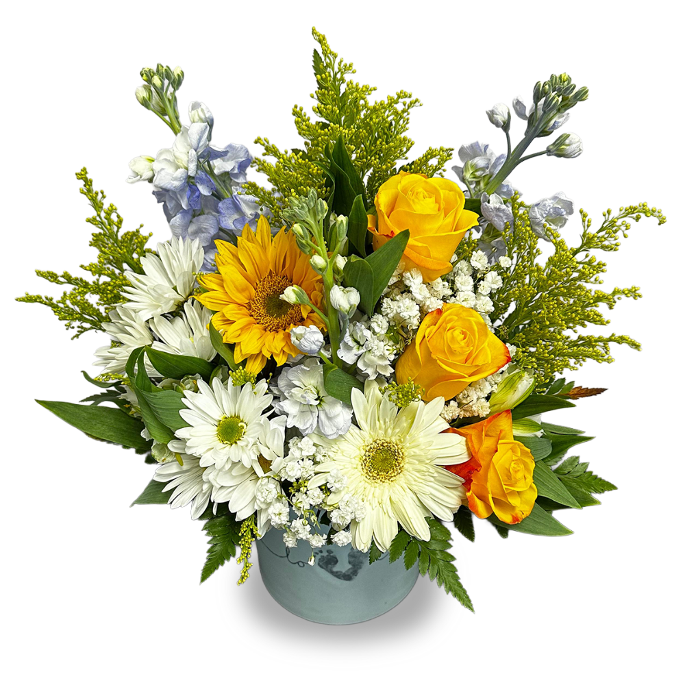 Close-up of the pastel blue ceramic keepsake vase showing the embossed footprint heart art surrounded by fresh yellow roses