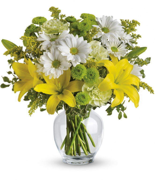 Brightly Blooming by Days Flowers Florida featuring yellow Asiatic lilies, green carnations, white daisy chrysanthemums, green button chrysanthemums, solidago, and fresh greenery in a classic clear glass ginger jar.