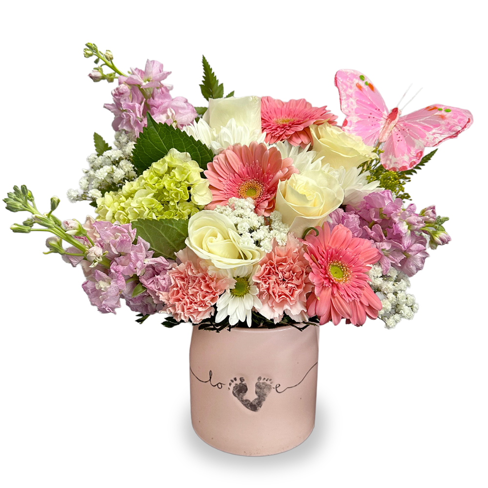 Butterfly Kisses newborn flower arrangement with white roses, pink gerberas, and a butterfly accent in a pink footprint love vase by Days Flowers Florida.