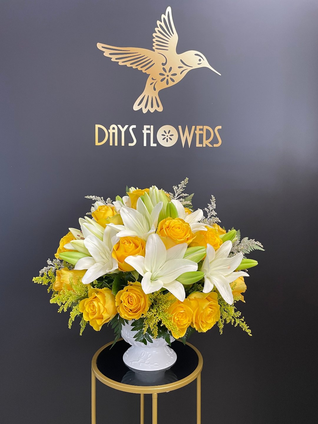 Elegant white and yellow floral arrangement by Days Flowers, free delivery in Summerfield, Ocala, Orlando, The Villages, Port St Lucie