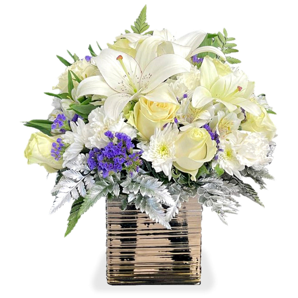Elegant Serenity Bouquet by Days Flowers Florida featuring premium white roses, baby’s breath, purple statice, silver-dollar eucalyptus, lush greenery, and soft yellow accents in a chic golden openwork vase.