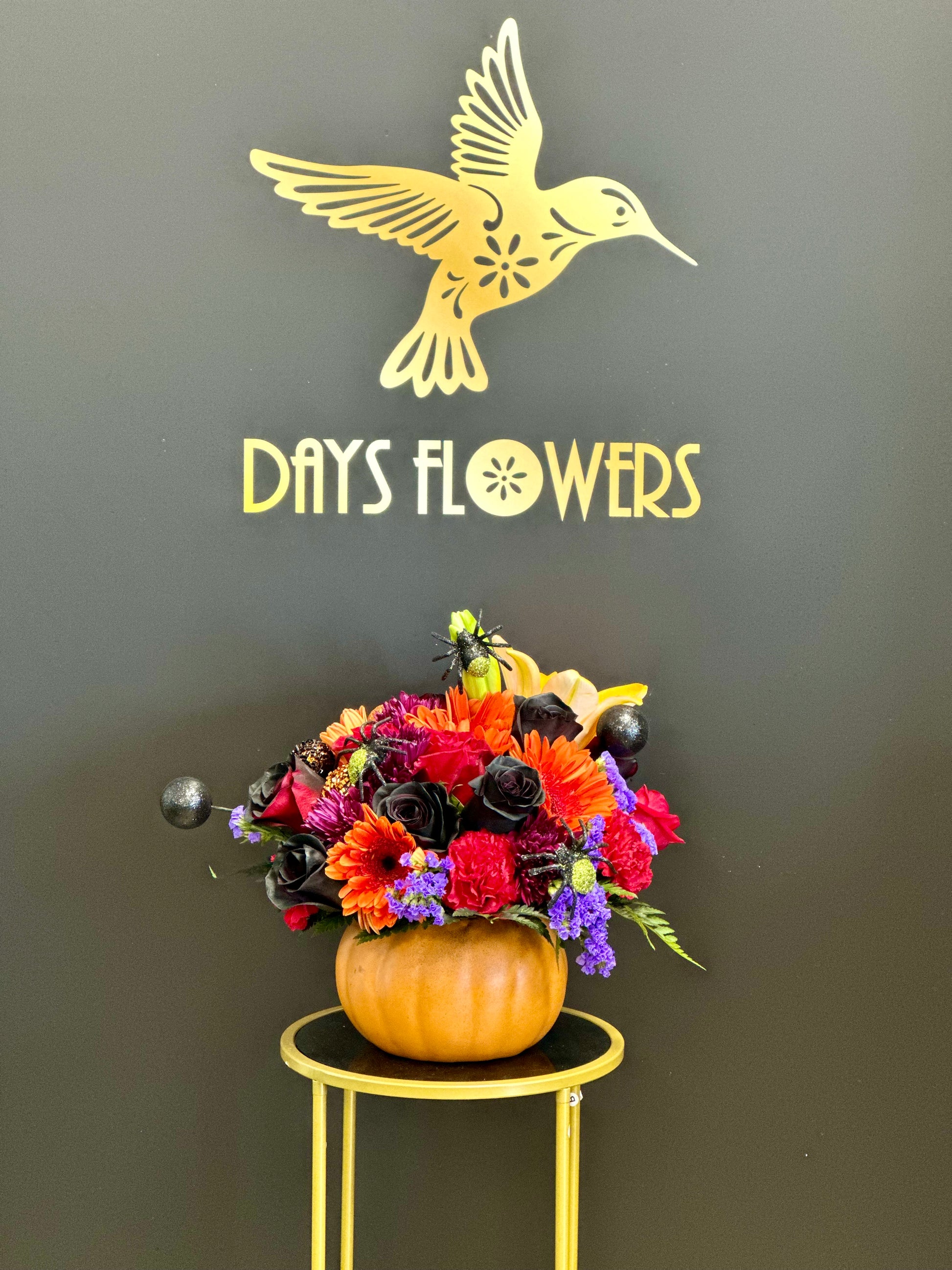 Days Flowers Florida: Halloween Glow bouquet. Orange and yellow blooms add a touch of seasonal magic to your home decor in Ocala, Florida