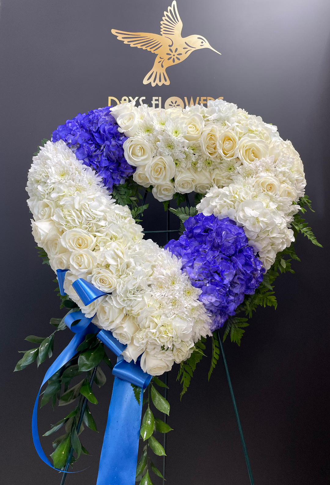 Days Flowers Florida: Heartfelt Sympathy tribute featuring white roses and serene blue hydrangeas. Elegant, comforting flower delivery in Port St. Lucie.