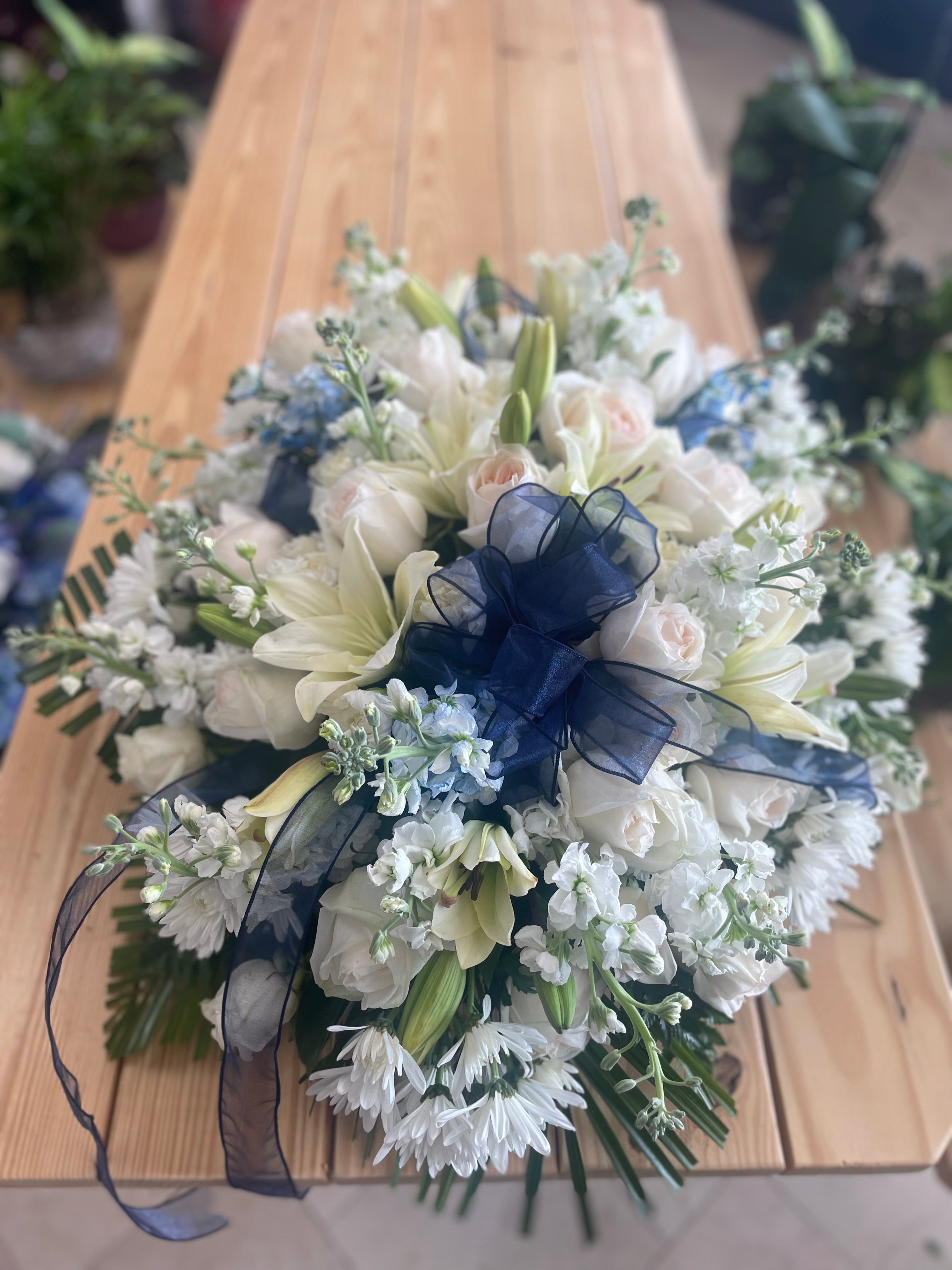 blue-sympathy-heart-wreath-with-roses