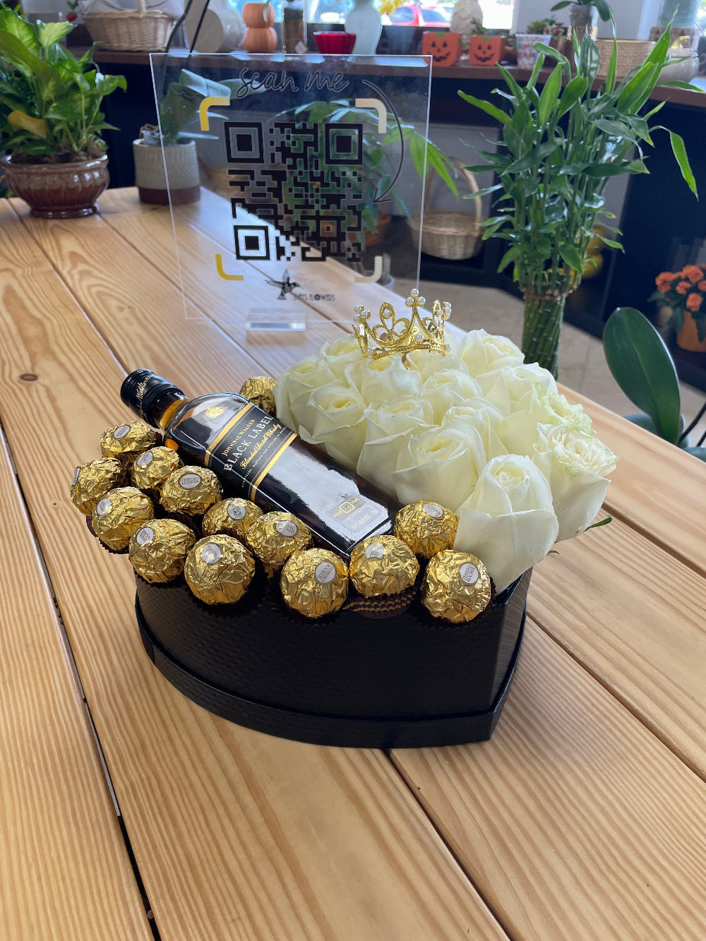 Luxury romantic gift box featuring fresh roses, assorted chocolates, and a bottle presentation from Days Flowers Florida, ideal for anniversaries, romantic celebrations, birthdays, and special day surprises.
