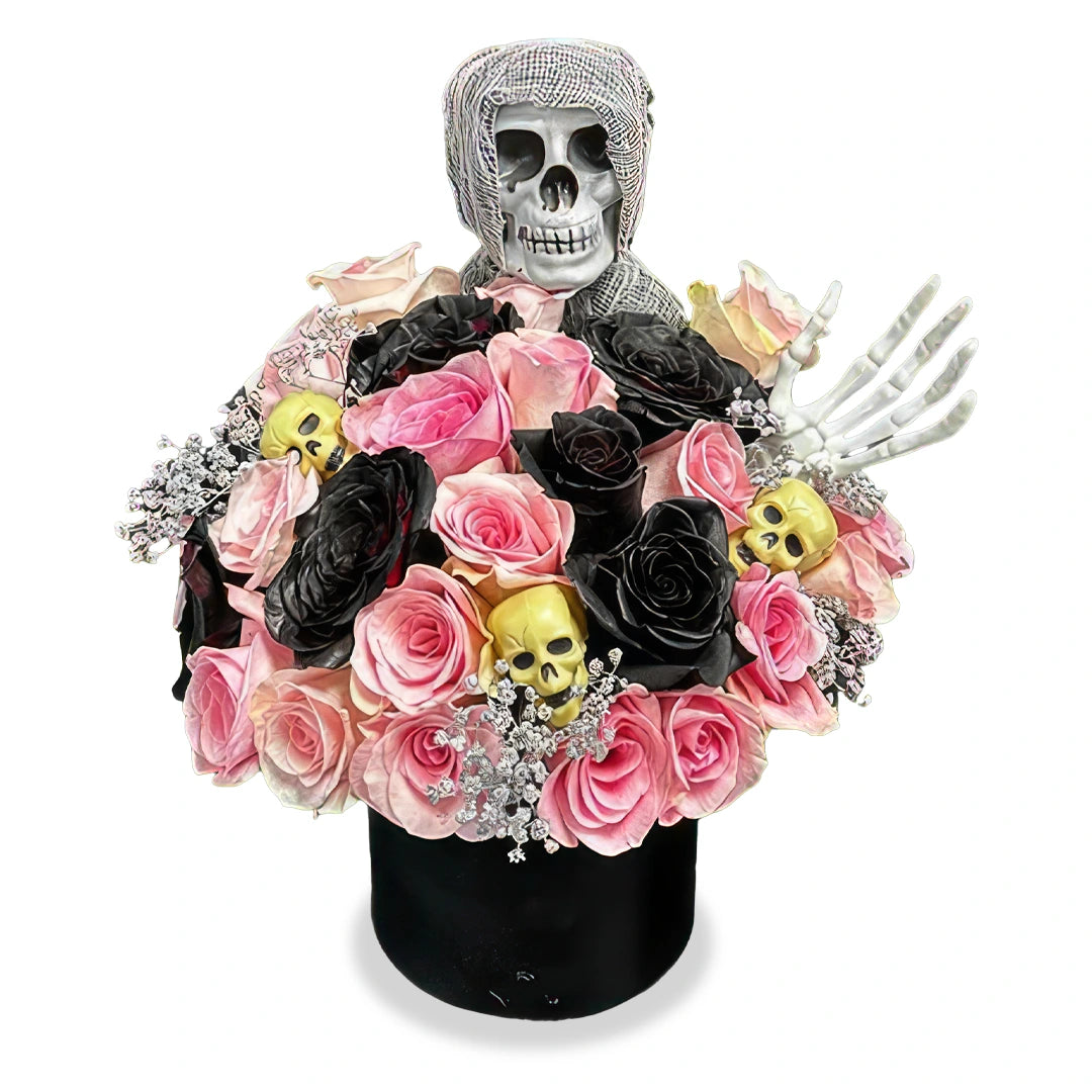 Days Flowers Florida: Bold Halloween decoration with pink and black roses, golden skulls, and a skeleton. Dark, elegant decor delivery in Summerfield, FL.