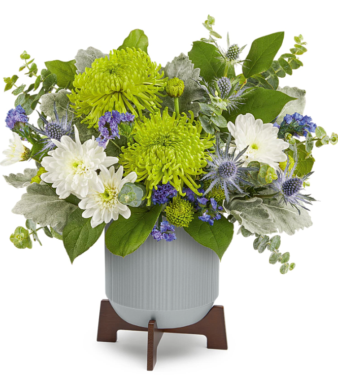 Modern Chic Bouquet flower arrangement by Days Flowers Florida, displaying unique green disbud chrysanthemums, blue eryngium, and fresh eucalyptus foliage inside a gray contemporary planter with a wooden base.