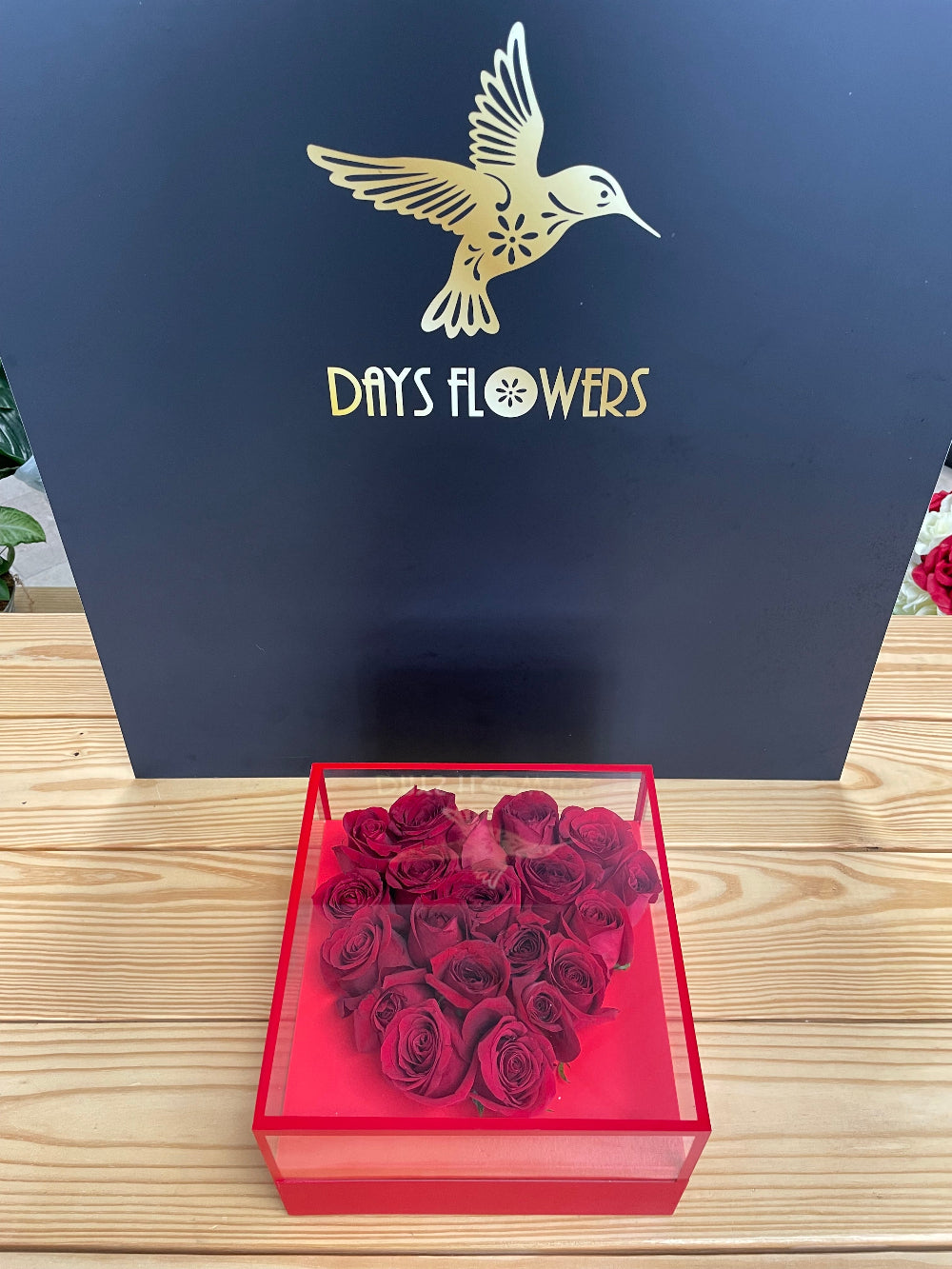Close-up studio view of the Radiant Romance Collection by Days Flowers Florida, capturing the vibrant red hues and rich textures of long-lasting luxury roses designed for special celebrations.