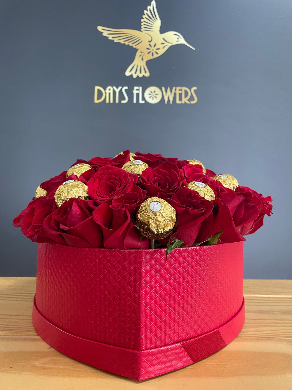 Close-up studio view of the Romance in a Box design by Days Flowers Florida, capturing the velvet textures of thirty romantic roses crafted for unforgettable celebrations.