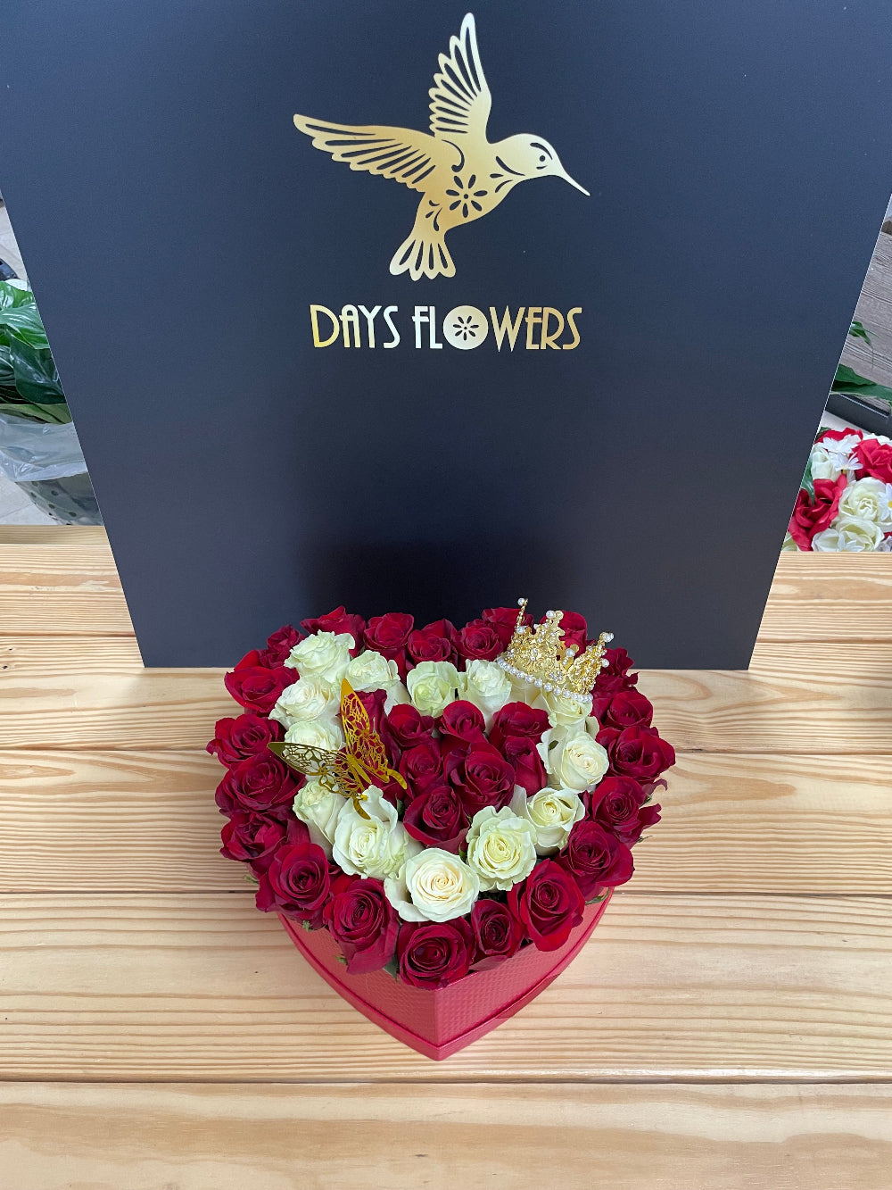 High-end display of the Royal Bloom Crown rose box by Days Flowers Florida, tailored as a stunning surprise gift centerpiece for sweet sixteens, princess parties, and grand events.