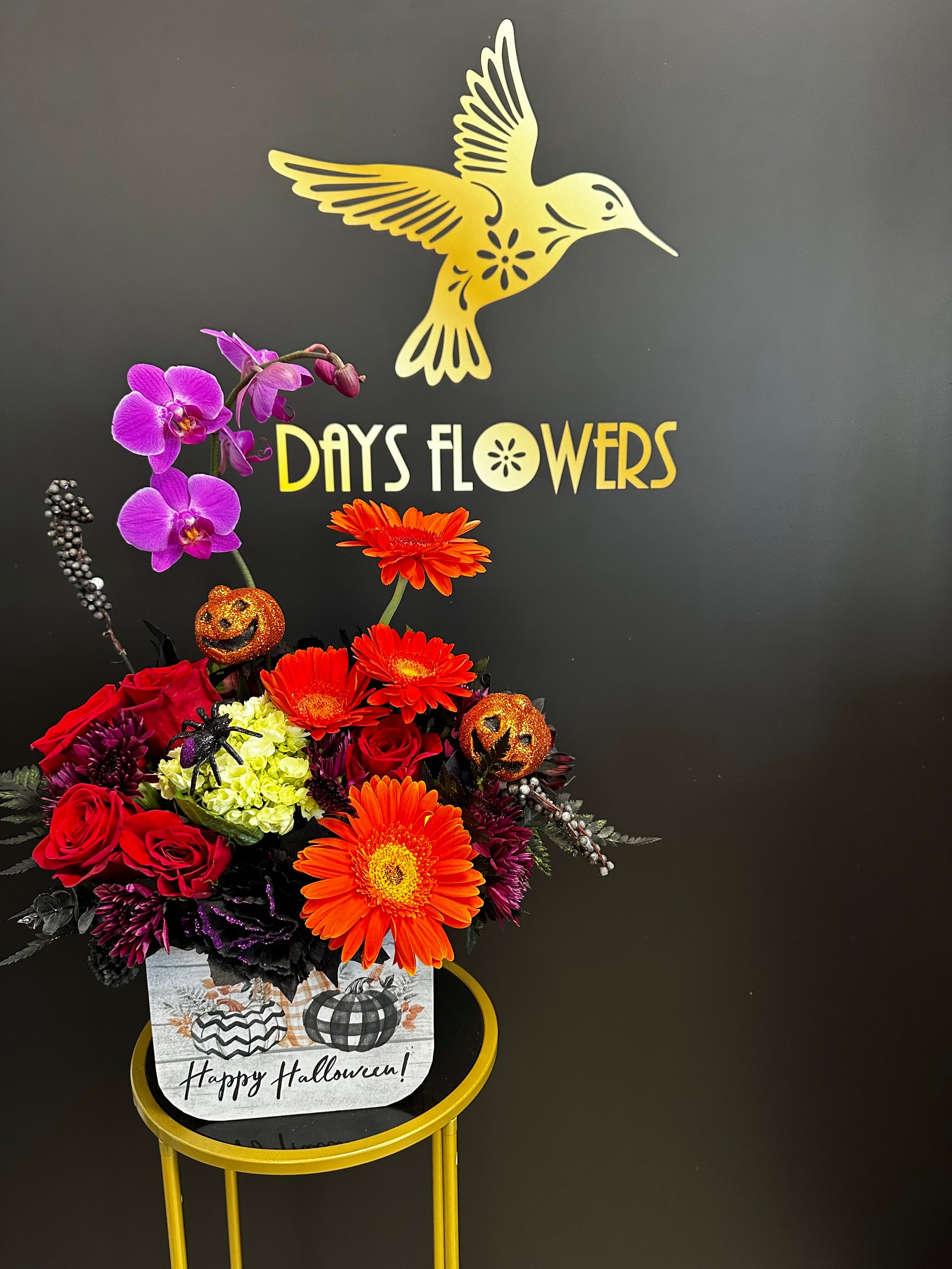 Days Flowers Florida: Sweet touch Halloween bouquet. Vibrant orange and yellow blooms for festive decor delivery in Port St. Lucie.