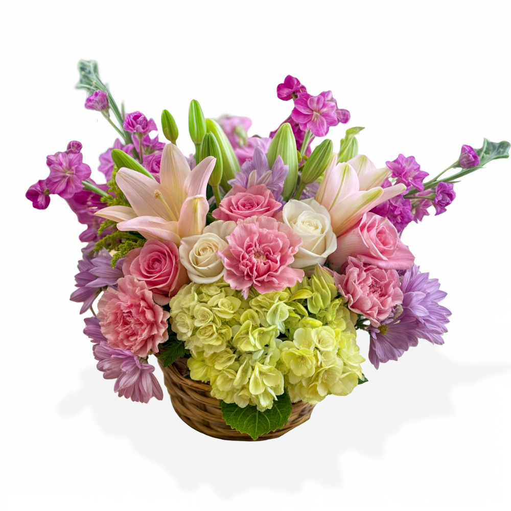 Spring Rainbow floral arrangement with pink lilies, white roses, and green hydrangeas in a rustic wicker basket by Days Flowers Florida.