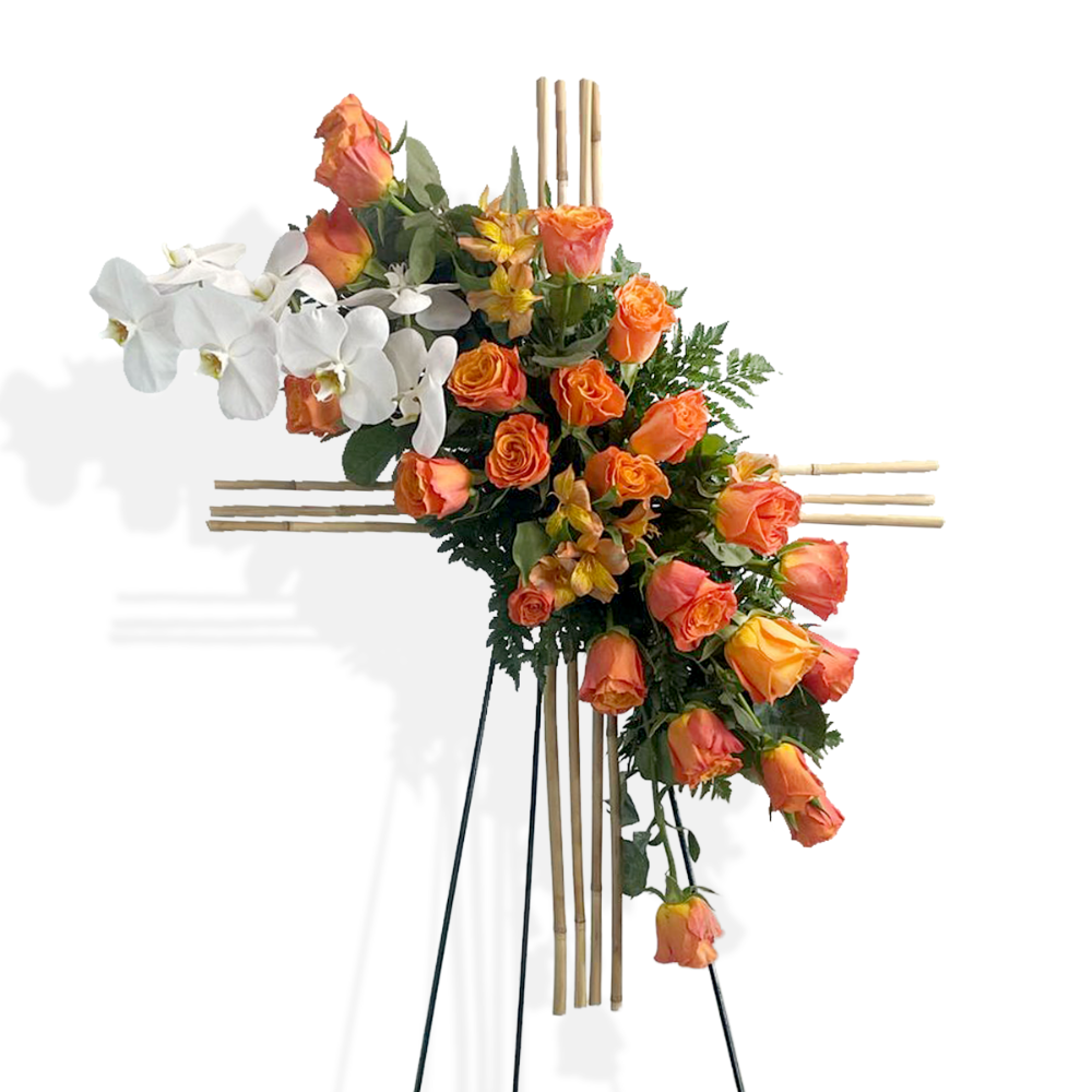 Standing funeral cross of orange roses and white orchids on a bamboo structure by Days Flowers Florida.