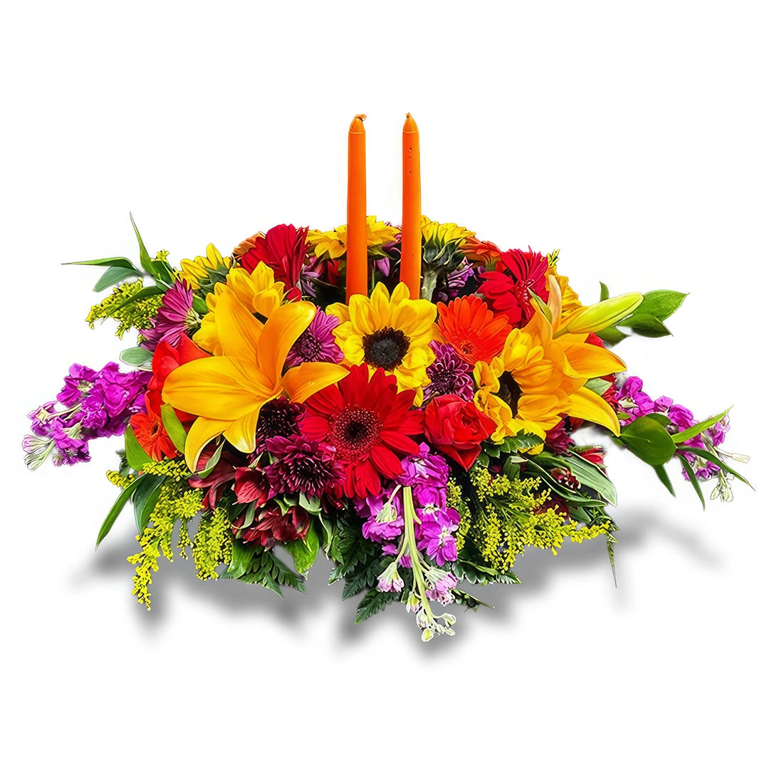 Days Flowers Florida: Vibrant Thanksgiving centerpiece with sunflowers, roses, and orange candles. Warm holiday table decor delivery in Ocala, FL.