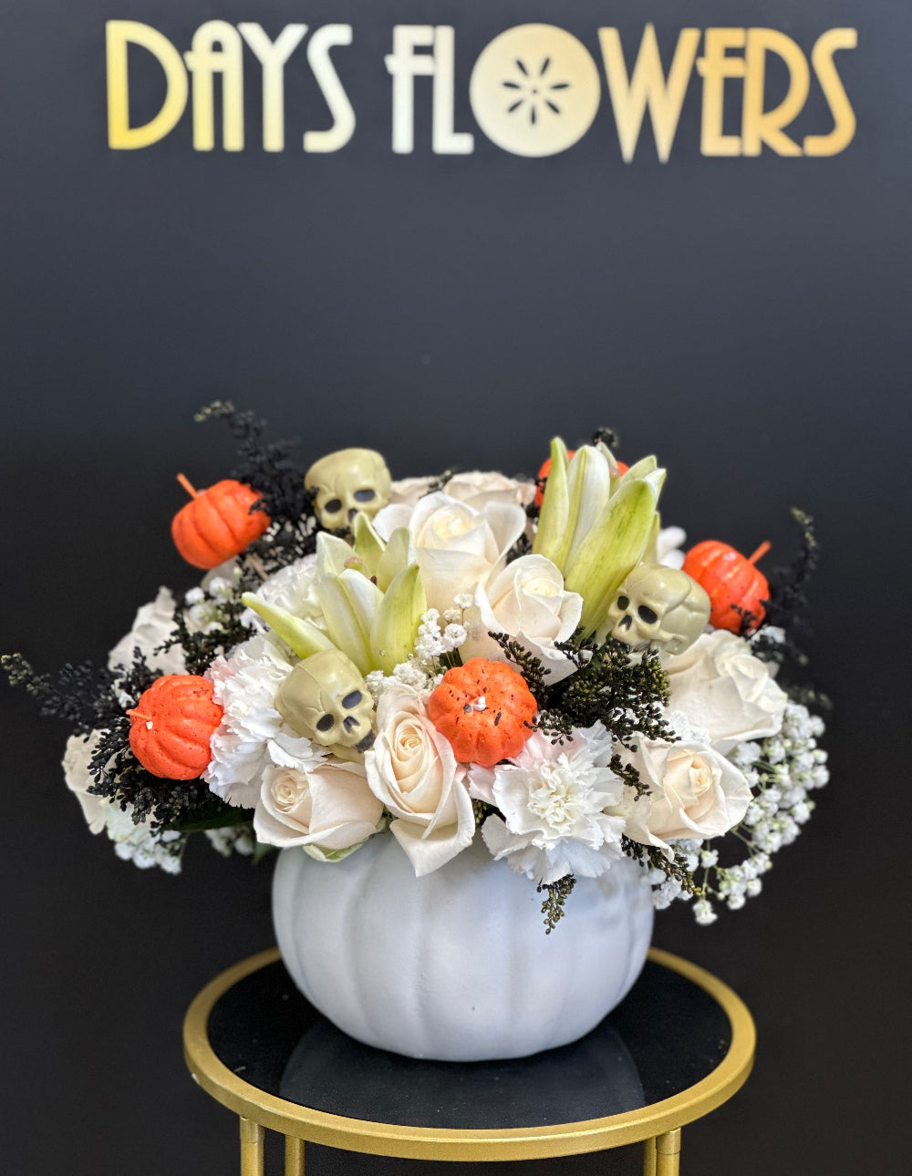 Close-up of rich orange and golden yellow autumn blooms surrounded by seasonal foliage