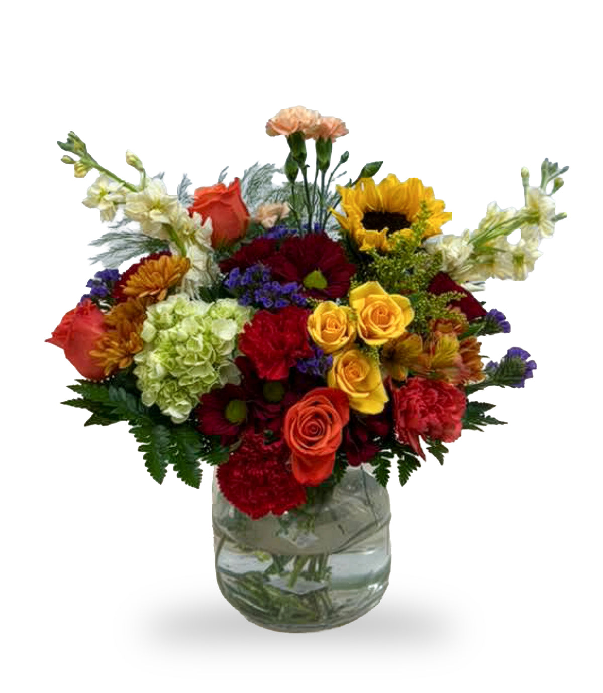 Autumn Sunset & Sunflower Splash arrangement by Days Flowers Florida, featuring a yellow sunflower, orange roses, red carnations, and a green hydrangea in a clear glass bubble vase