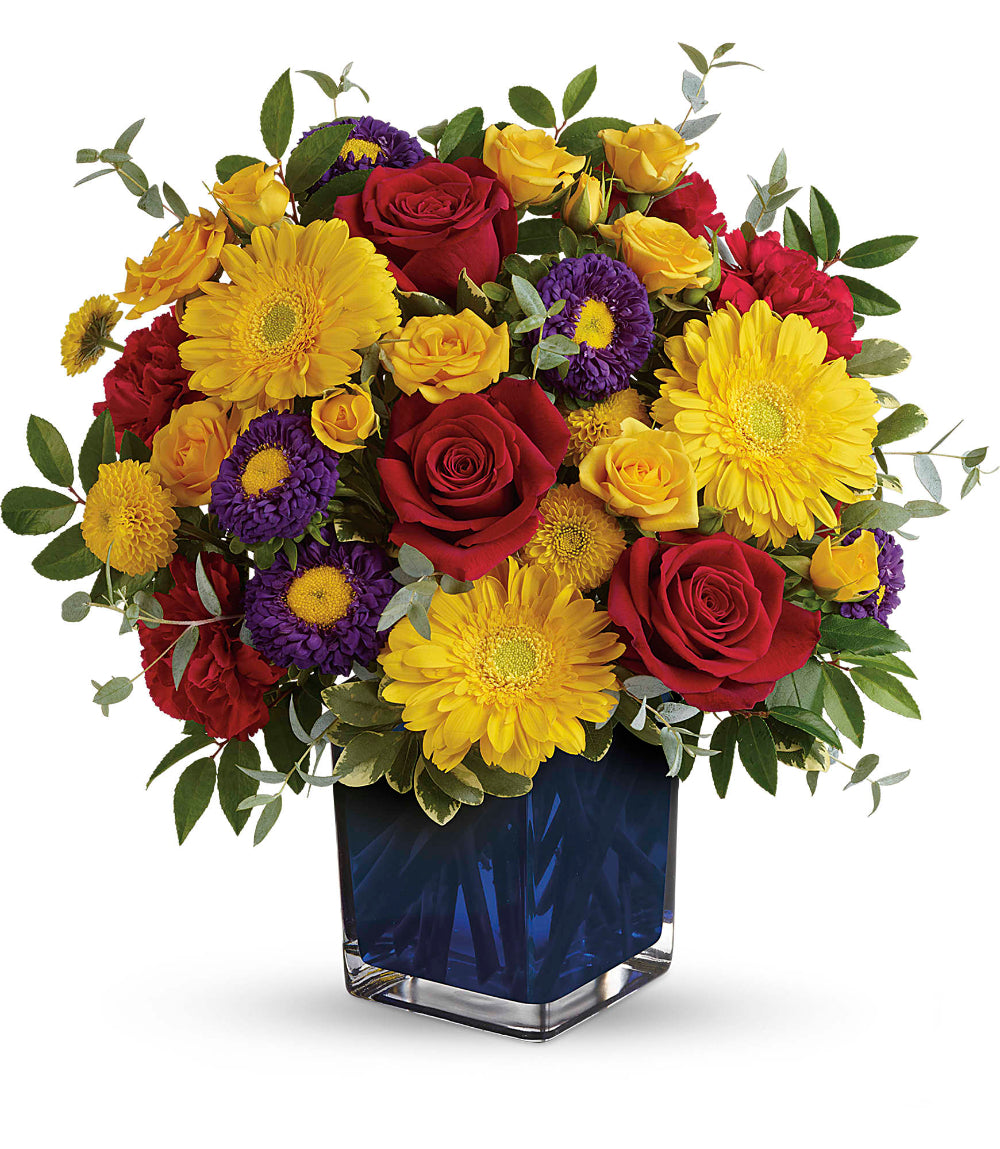 Top-down perspective of the Pretty Perfect Bouquet showing yellow miniature gerberas paired with red carnations and button mums