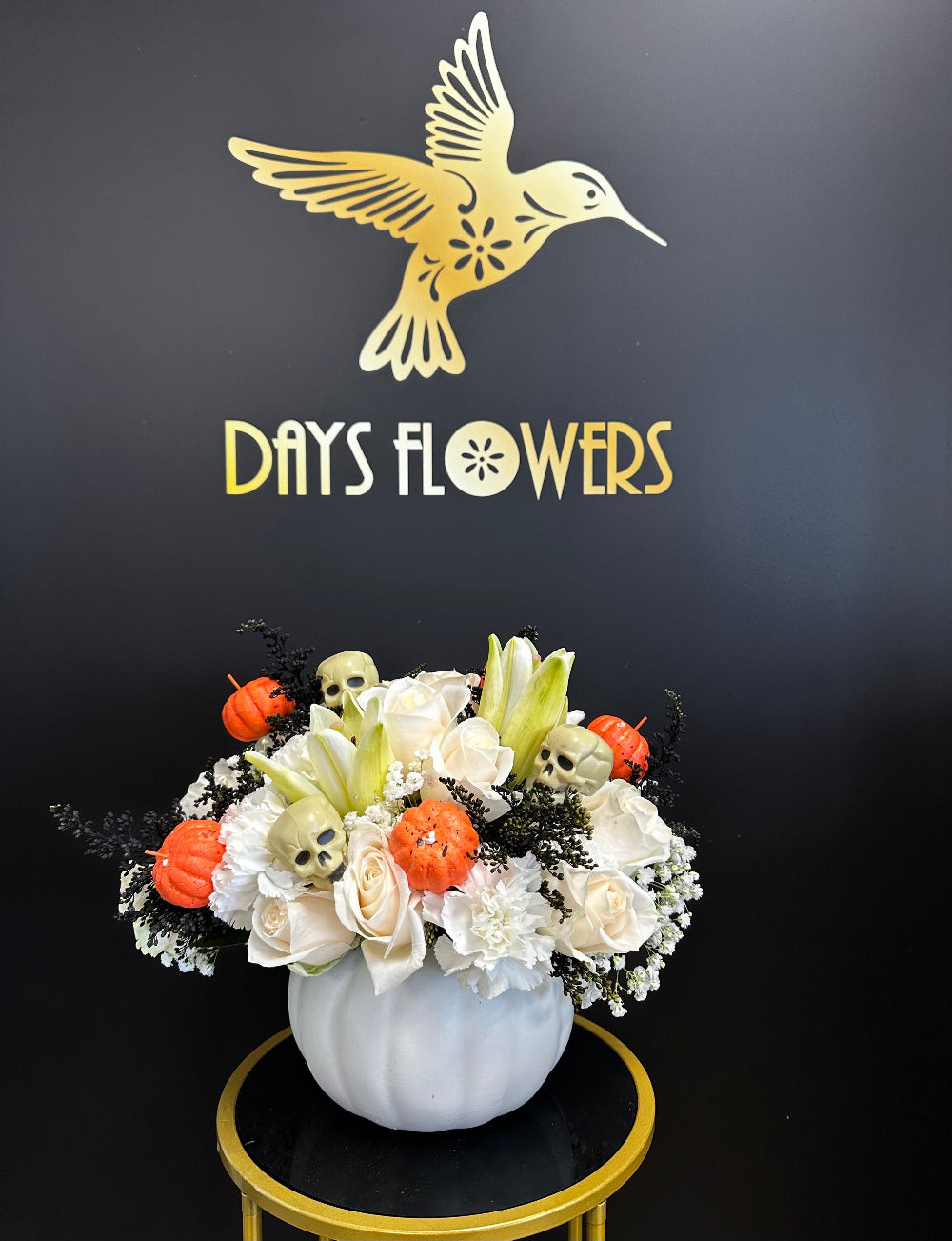 Side perspective of the autumn floral arrangement styled on a Thanksgiving dining room table setup