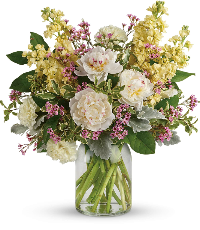 Elegant white peony and snapdragon arrangement in a clear vase, perfect for free delivery in Florida areas.