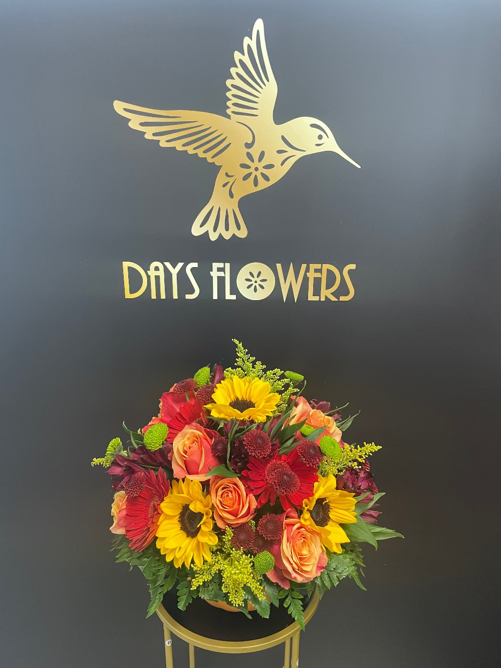 Top-down perspective of the Pumpkin Bouquet showing radiant yellow and orange Halloween blossoms