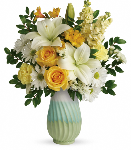 Elegant white lilies and yellow roses in a striped green vase, perfect for delivery in Summerfield, Ocala, Orlando, The Villages, and Port St. Lucie.