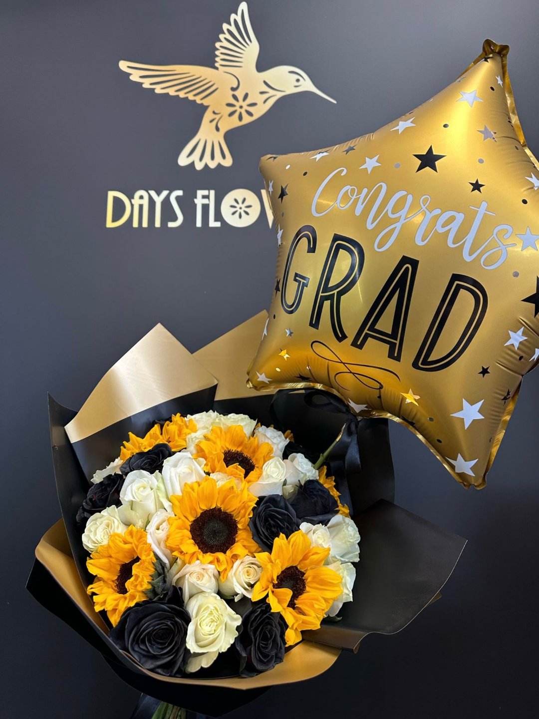 Graduation floral arrangement with balloon, free delivery in Summerfield, Ocala, Orlando, The Villages, and Port St. Lucie.