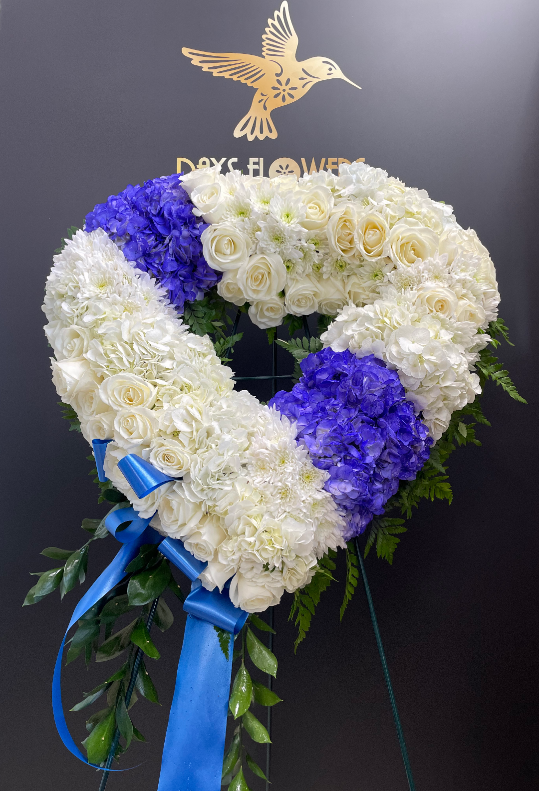 Heart-shaped floral wreath by Days Flowers, delivery in Florida.