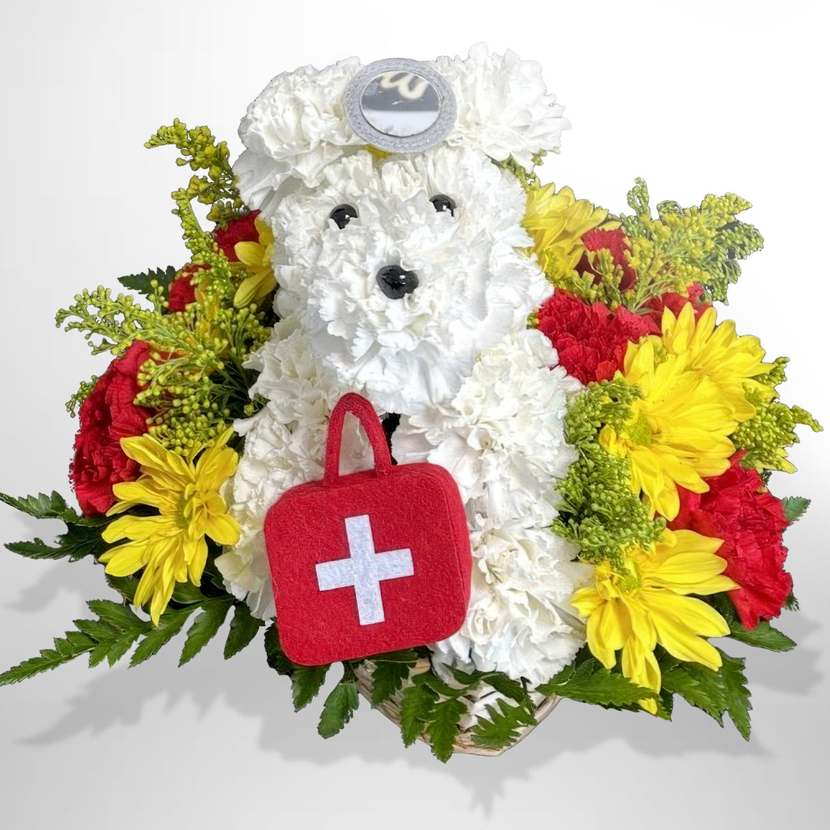 Healing Hugs get well flower arrangement featuring a white chrysanthemum dog with a stethoscope surrounded by red carnations by Days Flowers Florida.