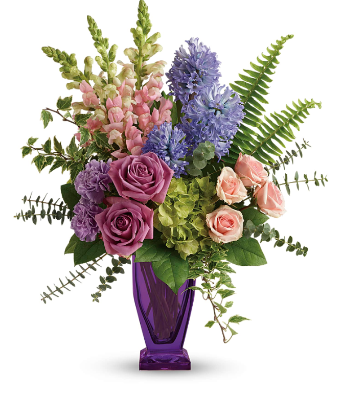 Elegant bouquet with pink snapdragons, lavender roses, and blue hydrangeas in a purple vase, perfect for free delivery in Florida areas.