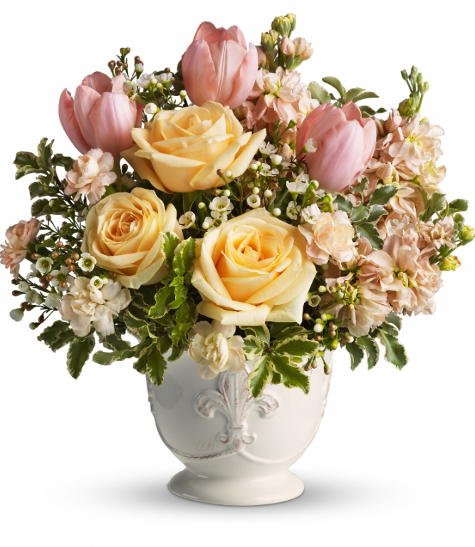 Elegant floral arrangement with yellow roses, pink tulips, and baby’s breath in a white vase, available for free delivery in Florida areas.