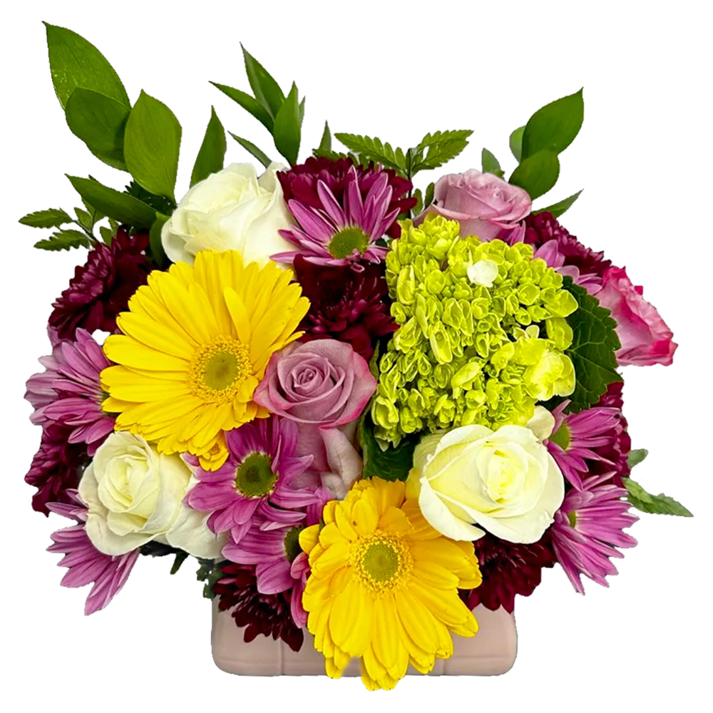 Side perspective of the colorful multi-textured floral centerpiece styled beautifully on a dining room console table.