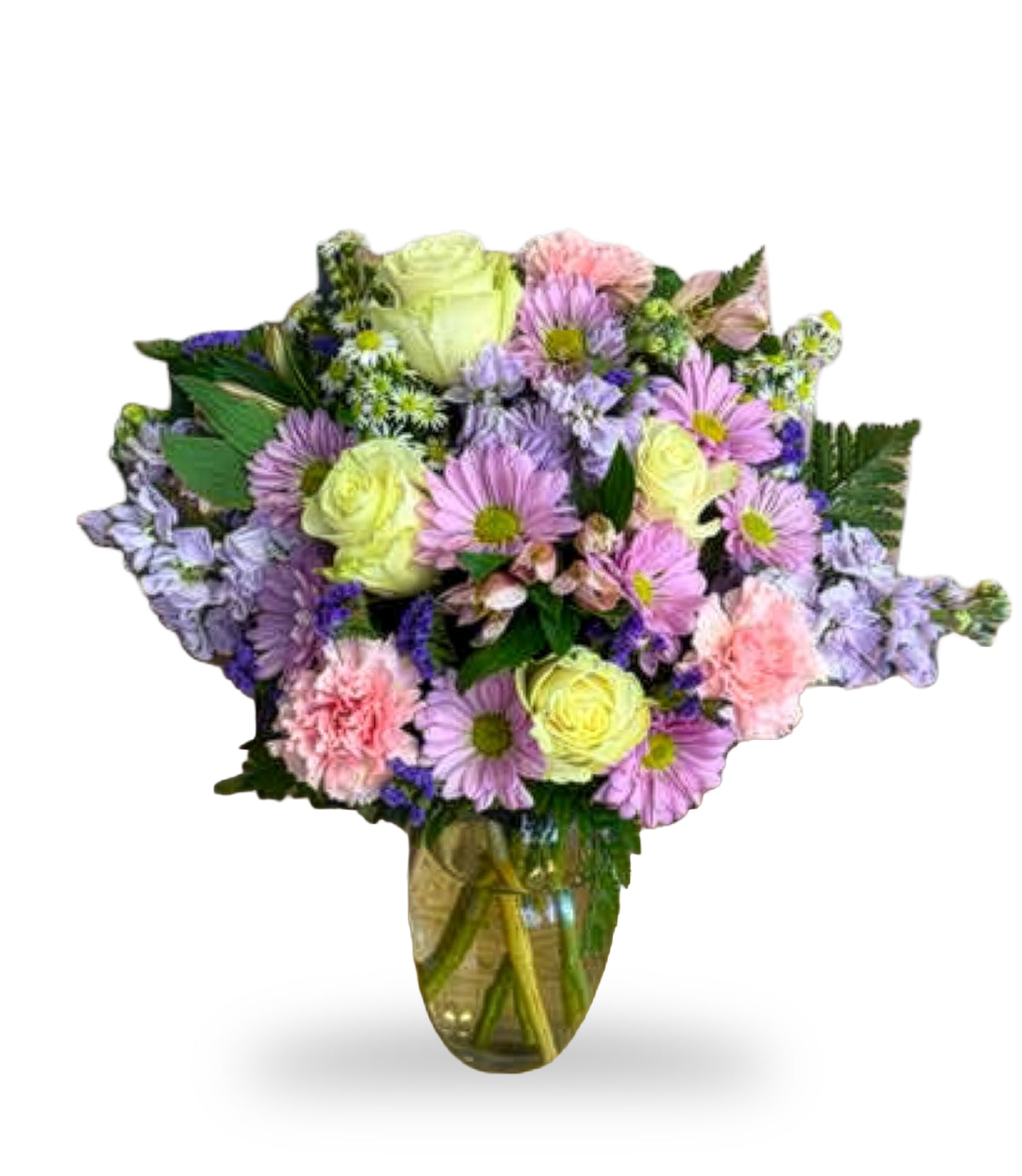 Pastel Serenade & Chrysanthemum Dream arrangement by Days Flowers Florida, featuring soft yellow roses, purple daisies, pink carnations, and blue delphinium in a clear glass vase.