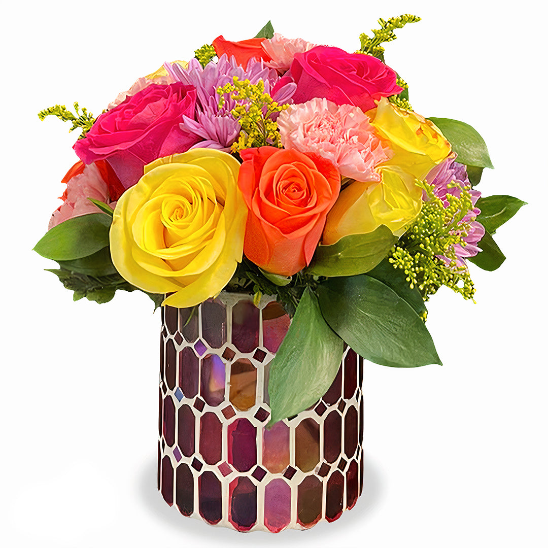 Pastel Shimmer Bouquet featuring peach roses, yellow spray roses, and lavender mums in an iridescent aqua glass vase by Days Flowers Florida