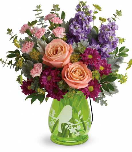 Elegant peach roses and purple lavender in a green vase, perfect for delivery in Summerfield, Ocala, Orlando, The Villages, and Port St. Lucie.