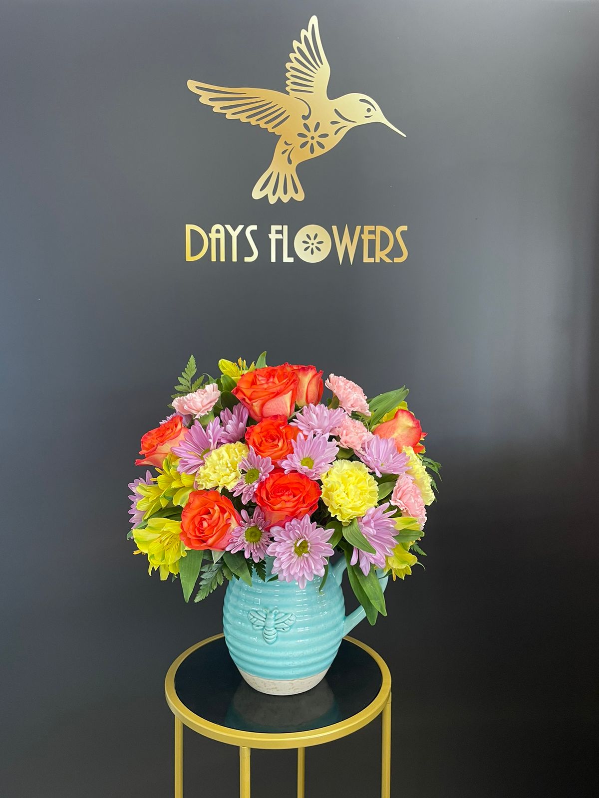 Colorful floral gift in blue vase by Days Flowers, delivery in Florida.