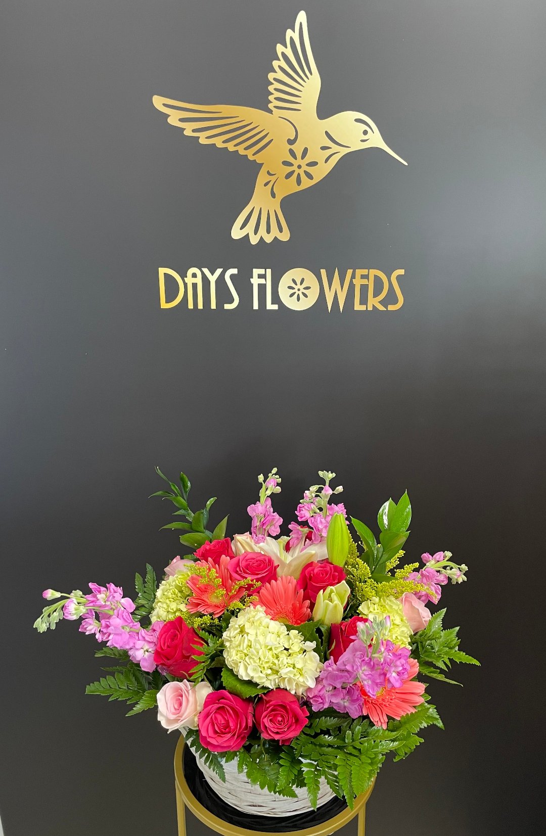 Vibrant floral arrangement by Days Flowers with roses, lilies, and greenery, perfect for delivery in Summerfield, Ocala, Orlando, The Villages, and Port St. Lucie.