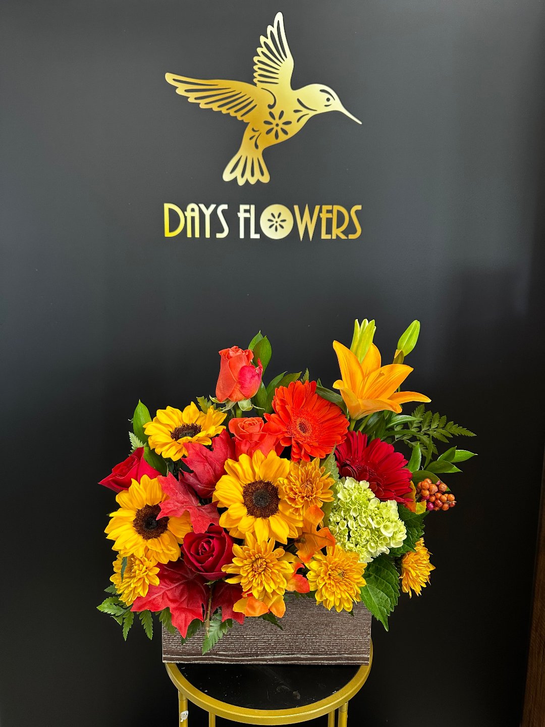 Bright bouquet with sunflowers, roses, and lilies, perfect gift from Day’s Flowers in Florida.